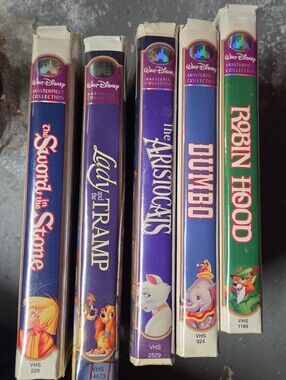 Disney VHS Set Spines in Purple, Blue, Green